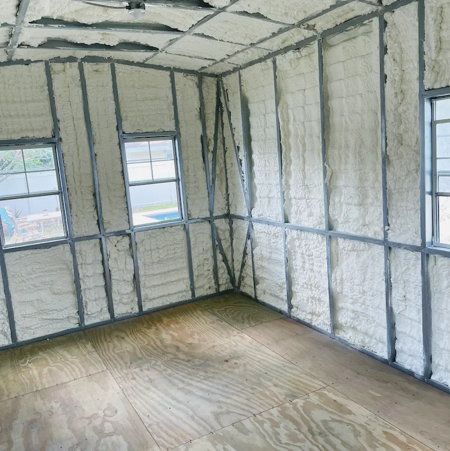 Closed-cell spray foam insulation applied to wall cavities in a residential project in Havre