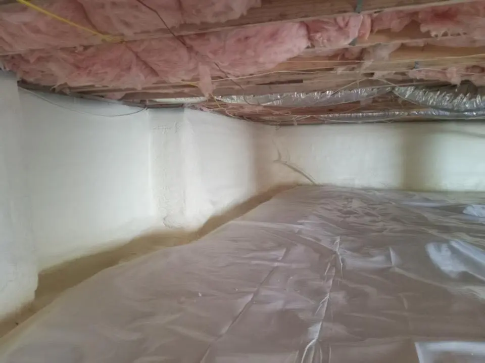 Crawl space encapsulation with closed-cell spray foam for Commercial Roof Restoration in Havre